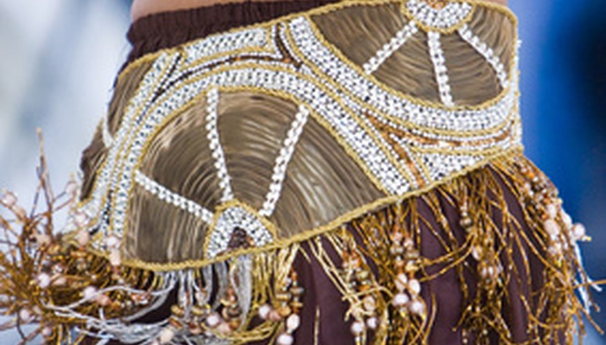 Photo Credit: Danse du ventre image by Pascal Péchard from <a href='http://www.fotolia.com'>Fotolia.com</a> The "cabaret" costume is a recent invention.