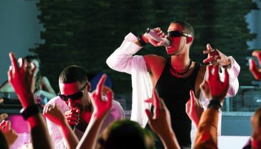 Hip hop musicians performing on stage Hip hop musicians performing on stage