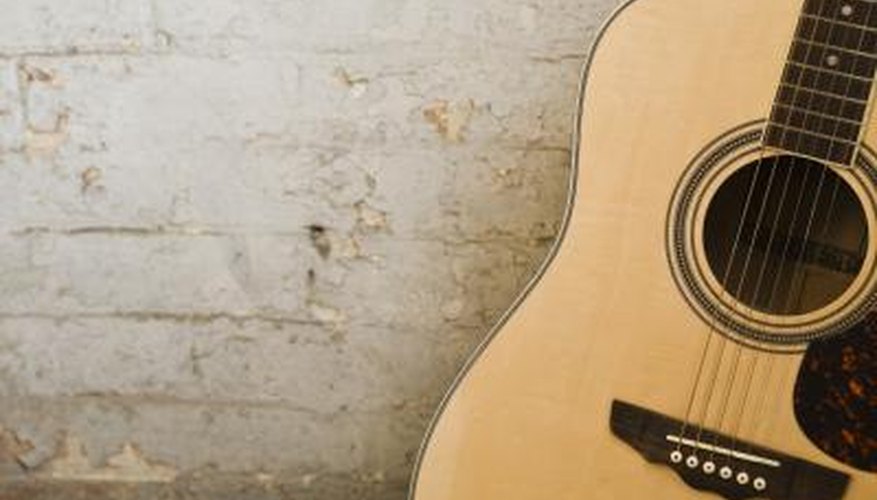 Photo Credit: Jupiterimages/Polka Dot/Getty Images Guitar on wall