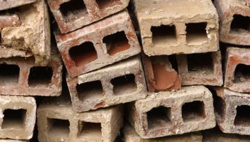 Use concrete blocks, with the holes turned outwards, to make a bed frame. Use concrete blocks, with the holes turned outwards, to make a bed frame.