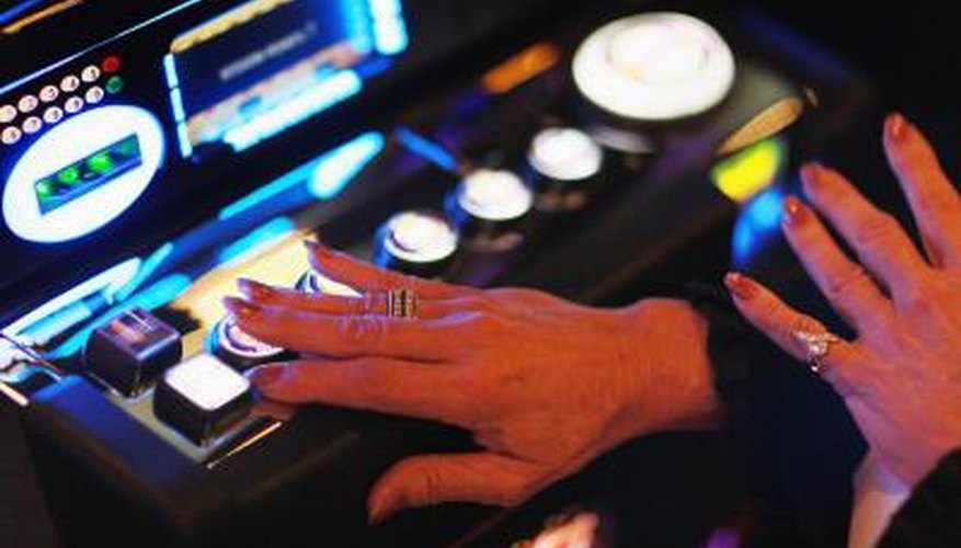 Hand of woman touching button on slot machine Hand of woman touching button on slot machine