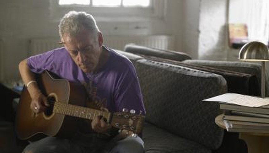 Photo Credit: John Howard/Digital Vision/Getty Images Man playing guitar