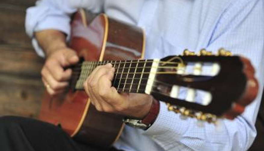 Photo Credit: zilva/iStock/Getty Images Man playing guitar