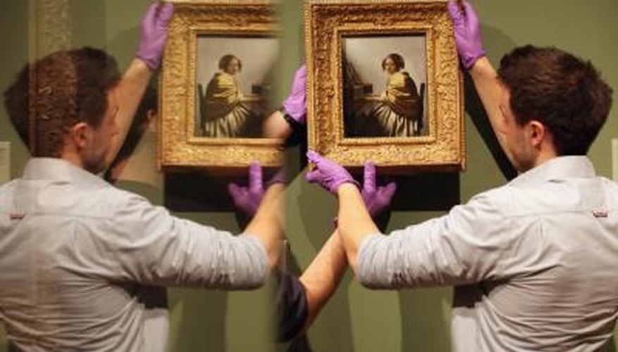 Hanging Vermeer paintings. Hanging Vermeer paintings.