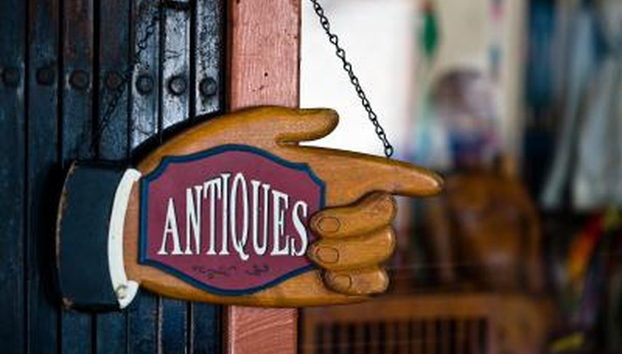 Photo Credit: Jupiterimages/Photos.com/Getty Images Antiques store sign.