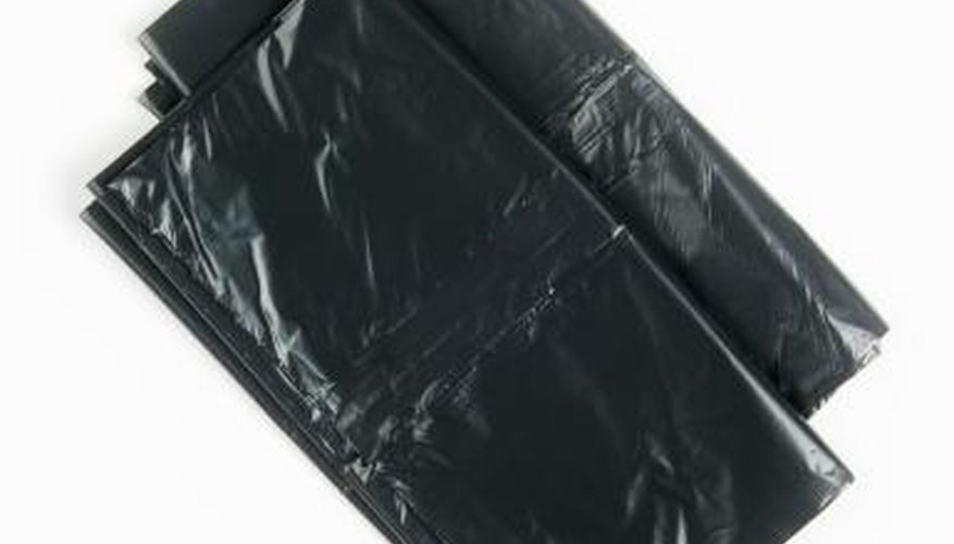 Black trash bags to cover seeds with. Black trash bags to cover seeds with.