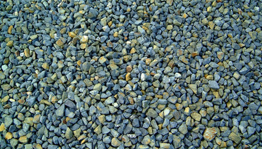 Colored gravel adds texture and accent to a flower bed. Colored gravel adds texture and accent to a flower bed.