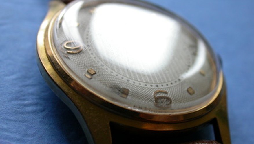 Photo Credit: watch image by Igor Katz from <a href='http://www.fotolia.com'>Fotolia.com</a> Many wristwatches open from the back, but a few open from the front and require a special tool.