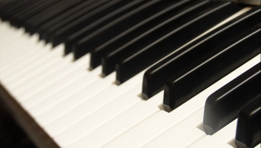 Photo Credit: piano keyboard closeup image by .shock from <a href='http://www.fotolia.com'>Fotolia.com</a> Keys lowest in pitch are on the far left side of a keyboard and move up in pitch with every key to the right.