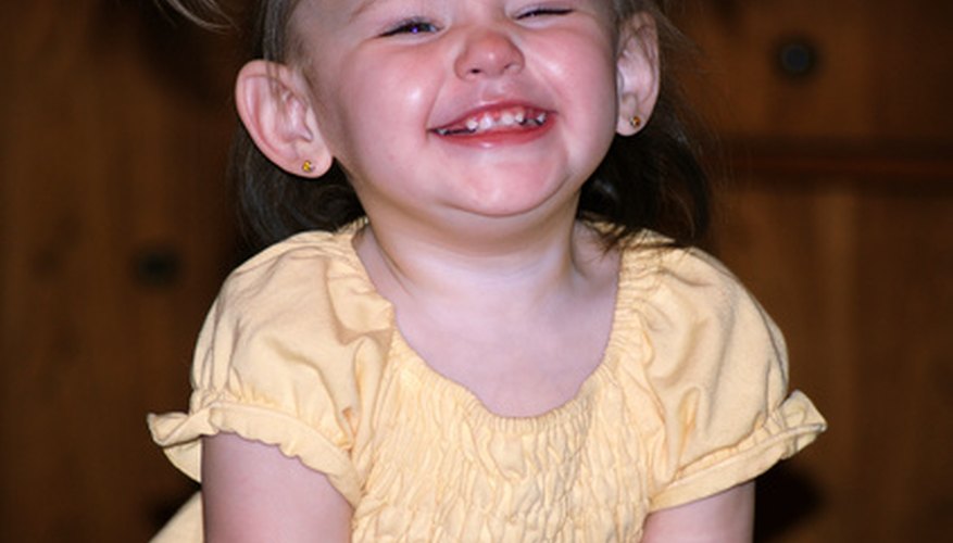 The darkening of a loose baby tooth is not always cause for alarm. The darkening of a loose baby tooth is not always cause for alarm.