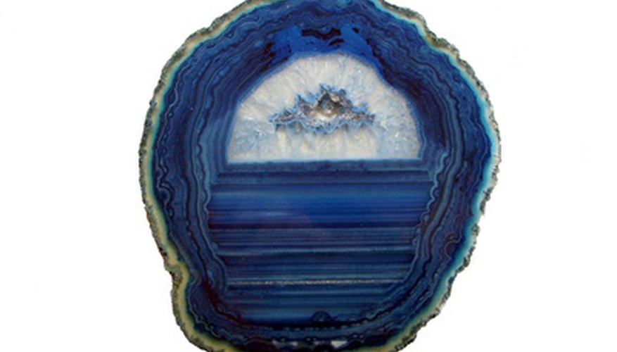 Agate stones tied to sticks in the garden may make flowers brighter--or they may simply make your mood more cheerful. Agate stones tied to sticks in the garden may make flowers brighter--or they may simply make your mood more cheerful.