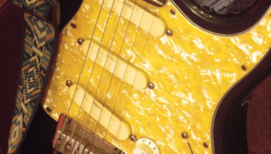 The pick guard of this electric guitar has a custom paint job. The pick guard of this electric guitar has a custom paint job.