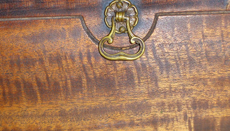 Photo Credit: antique desk image by Leticia Wilson from <a href='http://www.fotolia.com'>Fotolia.com</a> Does the desk need to be repaired?