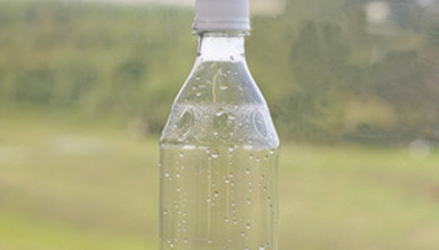 Photo Credit: water bottle image by Radu Razvan from <a href='http://www.fotolia.com'>Fotolia.com</a> The Bell water bottle holder will securely hold a full or empty water bottle while the bike is moving.