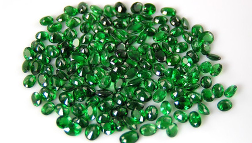 An untrained eye might associate green gemstones with emeralds without realizing that other gems such as this garnet can also appear green. An untrained eye might associate green gemstones with emeralds without realizing that other gems such as this garnet can also appear green.