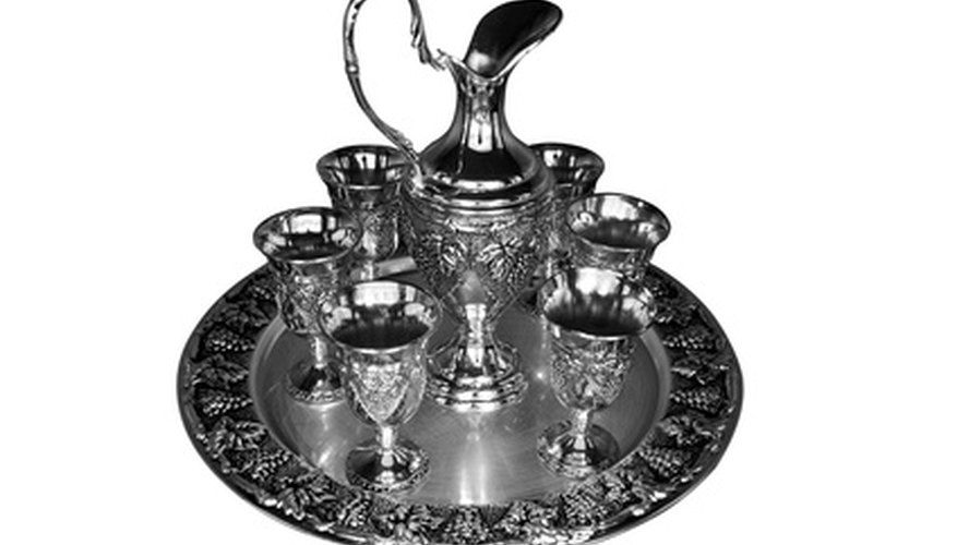 Photo Credit: Silver plate image by Dumitrescu Ciprian from <a href='http://www.fotolia.com'>Fotolia.com</a> Sheffield plate was often more decorative than sterling silver.
