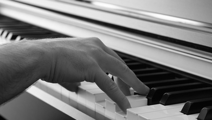 A hand in piano playing position. A hand in piano playing position.