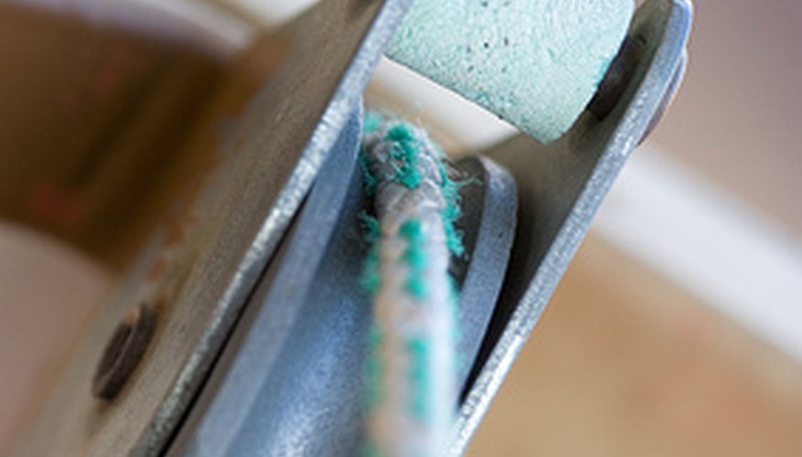 Check to be sure the wire is over the wheel of the pulley. Check to be sure the wire is over the wheel of the pulley.