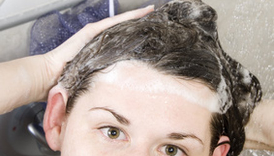 A mixture of shampoo and dish detergent removes baby oil from hair. A mixture of shampoo and dish detergent removes baby oil from hair.