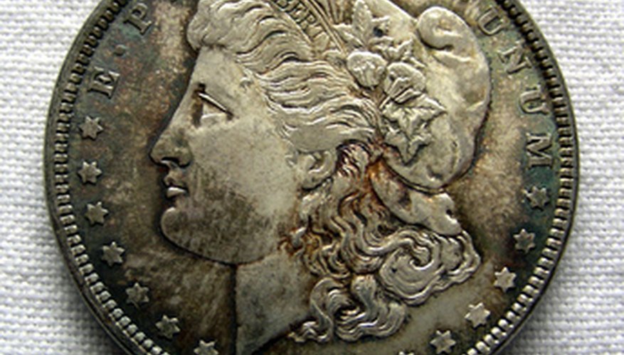 George T. Morgan designed the dollar coin that was named after him. George T. Morgan designed the dollar coin that was named after him.