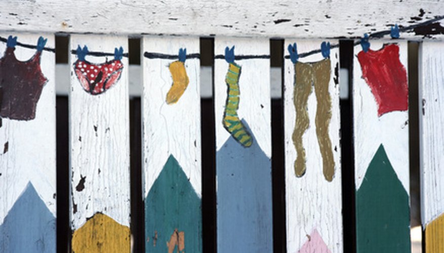 Folk art painting on a fence. Folk art painting on a fence.