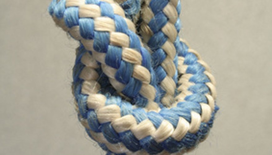 Tie the ends and cut the excess cord. Tie the ends and cut the excess cord.