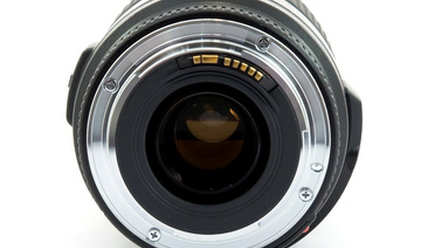 Photo Credit: dslr camera lens studio isolated image by dinostock from <a href='http://www.fotolia.com'>Fotolia.com</a> The EF mounting system, with no mechanical connections