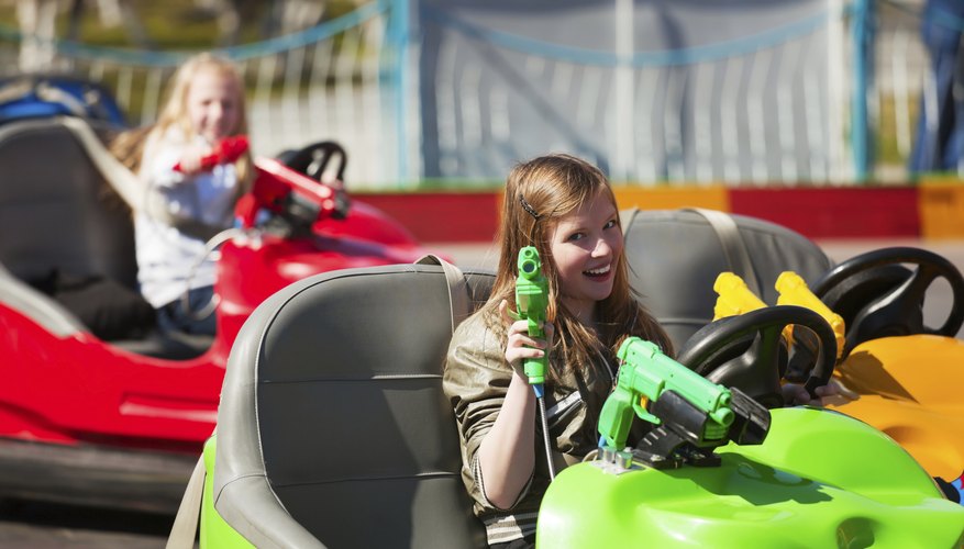 young girls in bumper cars young girls in bumper cars