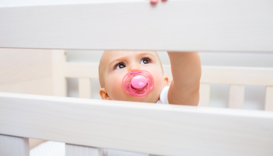 Baby reaching up in crib Baby reaching up in crib