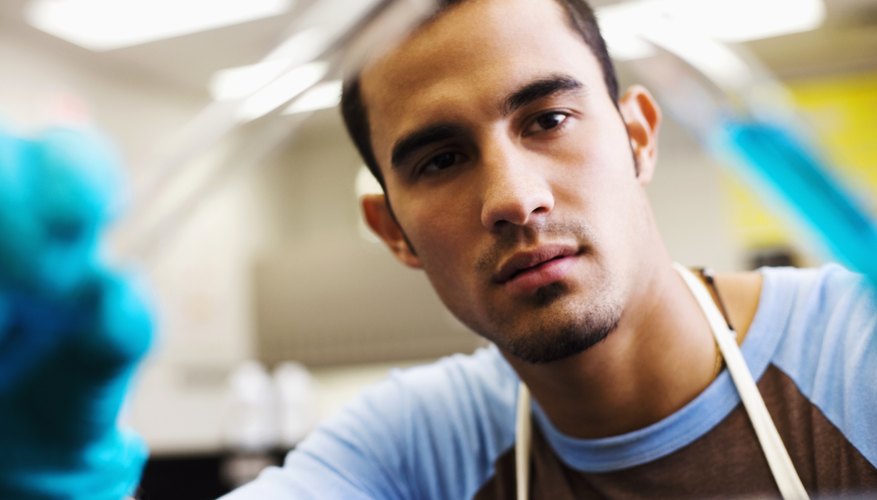 Student scientist working in laboratory. Student scientist working in laboratory.