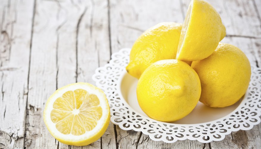 Small platter of lemons on table Small platter of lemons on table