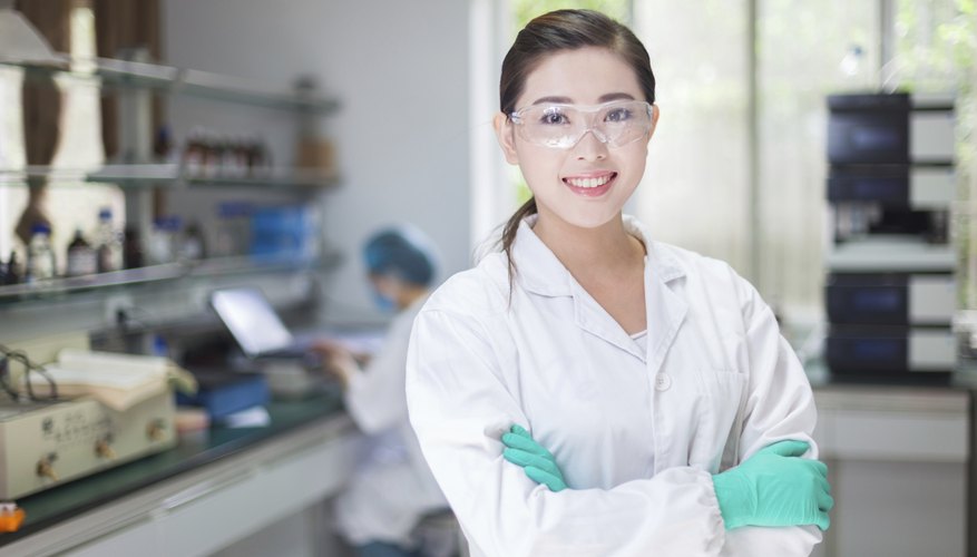 Smiling young chemist in laboratory Smiling young chemist in laboratory