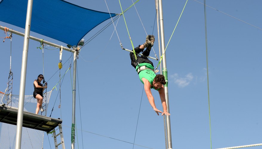 A visitor practicing trapeze at Trapeze School New York. A visitor practicing trapeze at Trapeze School New York.