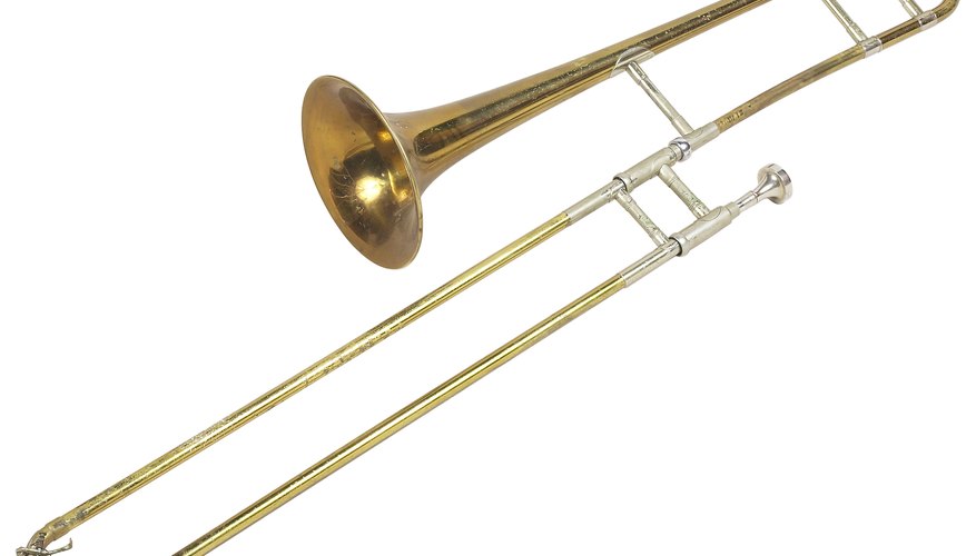 A cover slips over the mobile section of the trombone slide without covering the joint. A cover slips over the mobile section of the trombone slide without covering the joint.