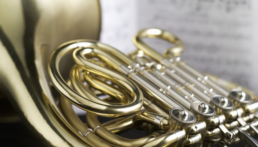 Repair a French horn by restringing the valves. Repair a French horn by restringing the valves.