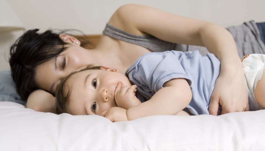 toddler on bed with mother toddler on bed with mother
