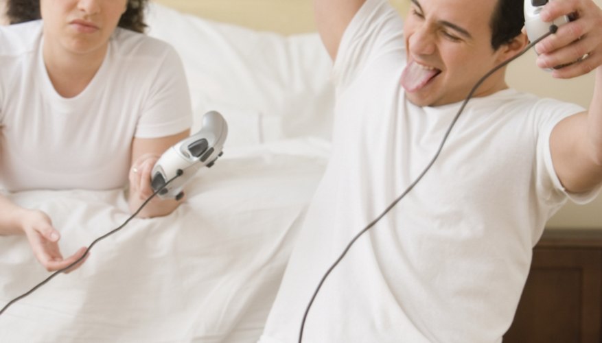 Couple playing video games. Couple playing video games.