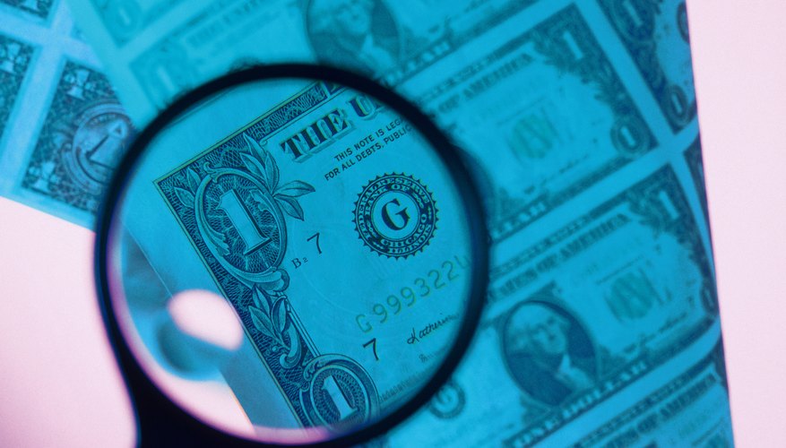 Using Magnifying Glass on upper left side of Dollar bill Using Magnifying Glass on upper left side of Dollar bill