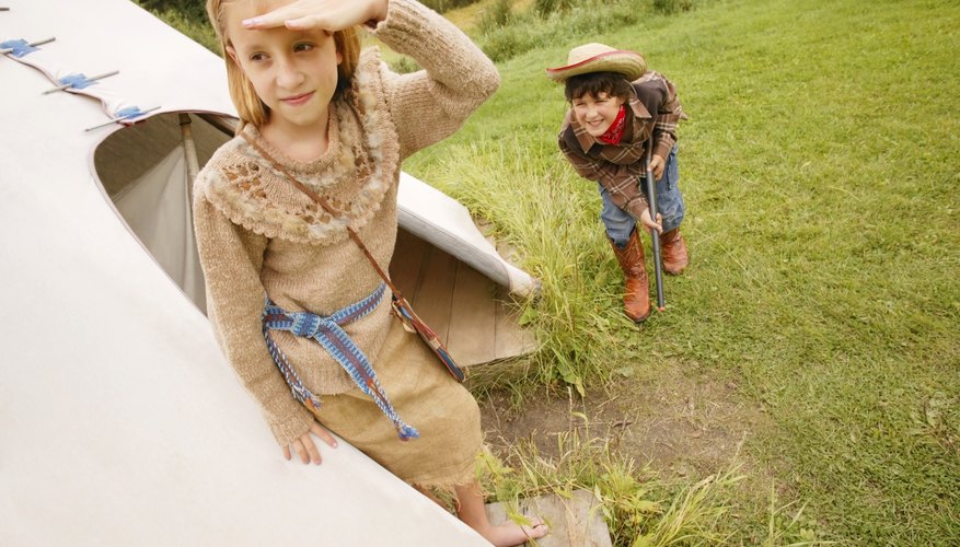 Photo Credit: Design Pics/Design Pics/Getty Images Children playing Cowboys and Indians