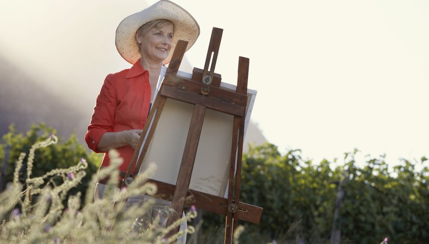 Woman painting in field Woman painting in field
