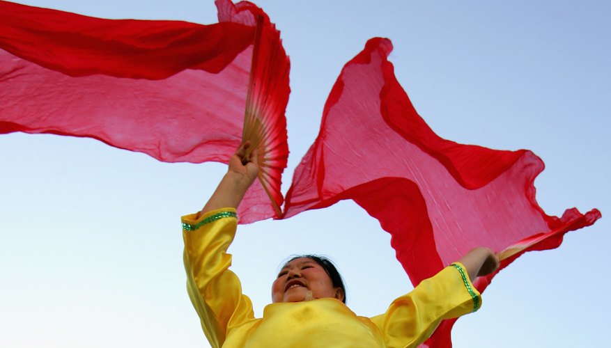 Fans and fabric are often used in dance. Fans and fabric are often used in dance.