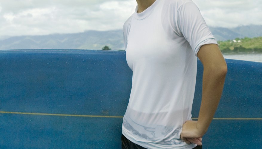 Restyle a plain white T-shirt into a side-fringe edgy look. Restyle a plain white T-shirt into a side-fringe edgy look.