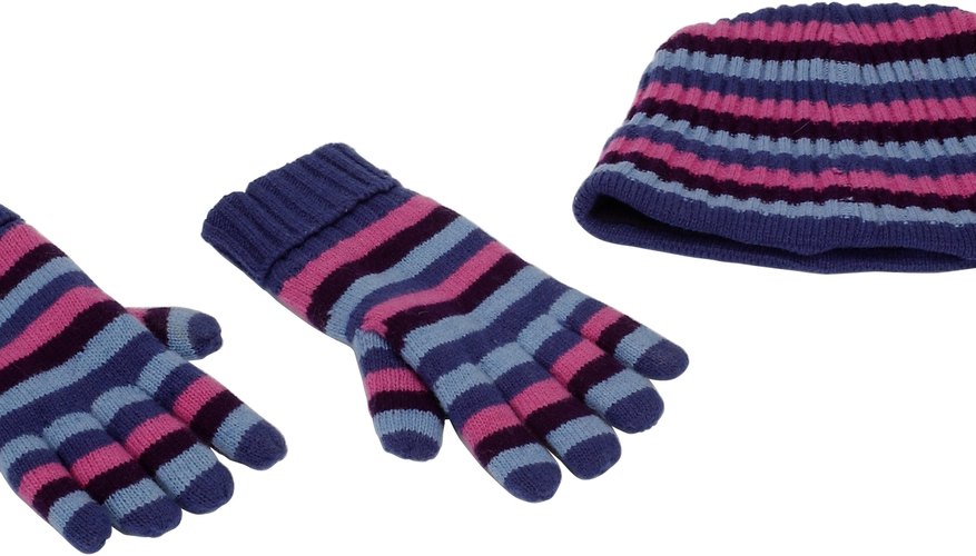Add pom poms to gloves for decoration. Add pom poms to gloves for decoration.