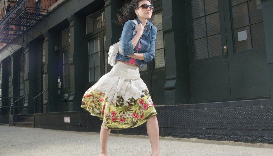 Add color to a white skirt with an embroidered bottom hem. Add color to a white skirt with an embroidered bottom hem.