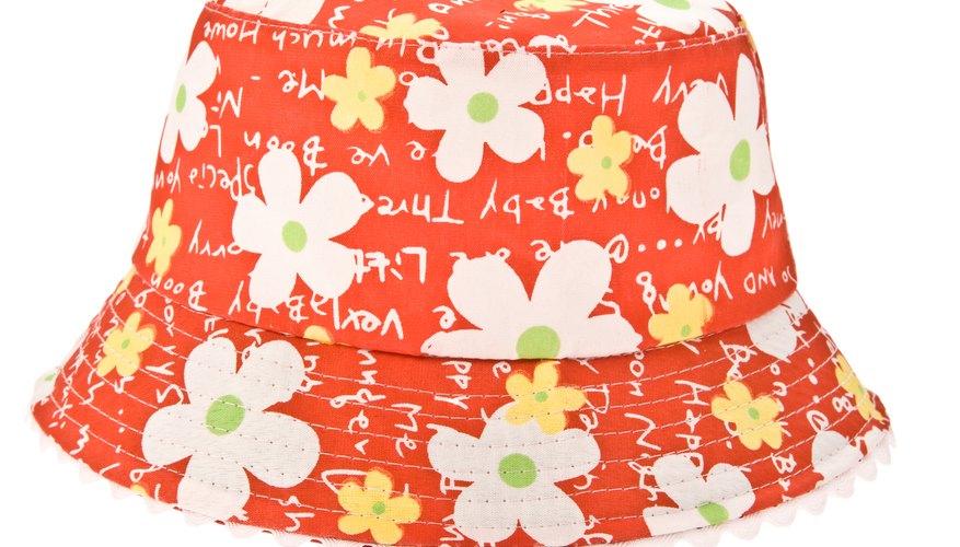 Use a stiff outer fabric and a soft lining to sew a fabric sun hat. Use a stiff outer fabric and a soft lining to sew a fabric sun hat.