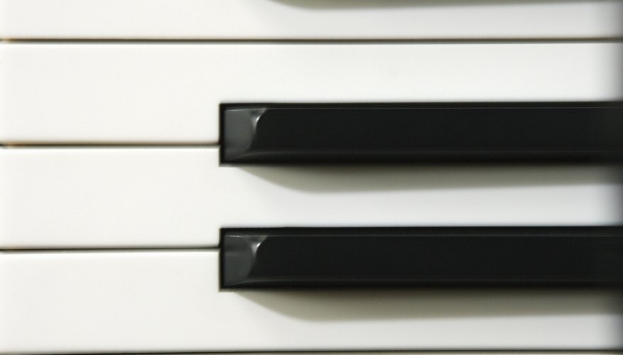 Photo Credit: Jupiterimages/Comstock/Getty Images Pianos have black keys in groups of two and three.