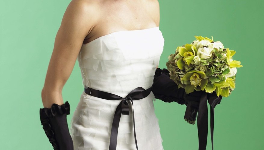 Trumpet-style gowns are tightly fitted through the bodice and hips. Trumpet-style gowns are tightly fitted through the bodice and hips.