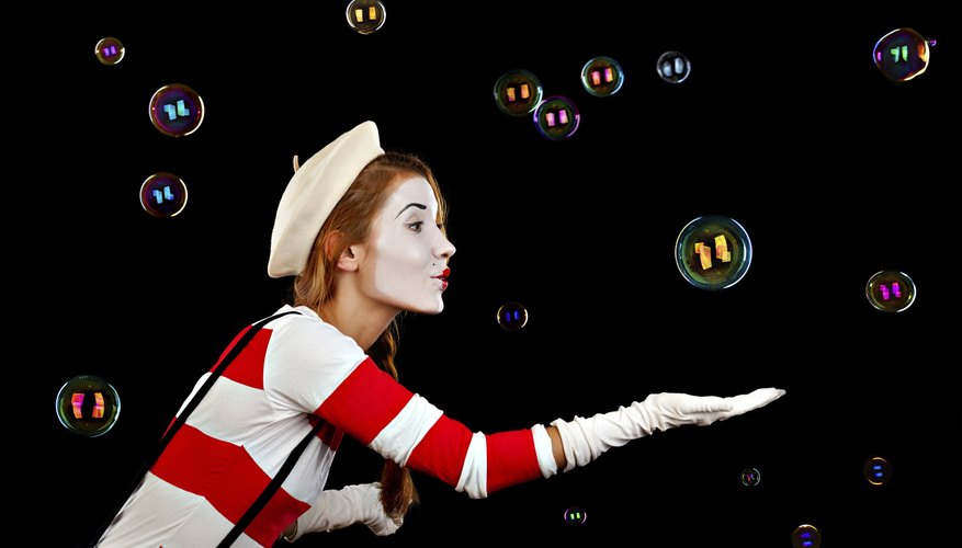 Photo Credit: ZavgSG/iStock/Getty Images Mime catching bubble