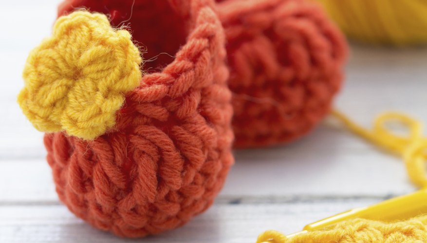 Single crocheting stitches together helps form toes of booties and slippers Single crocheting stitches together helps form toes of booties and slippers