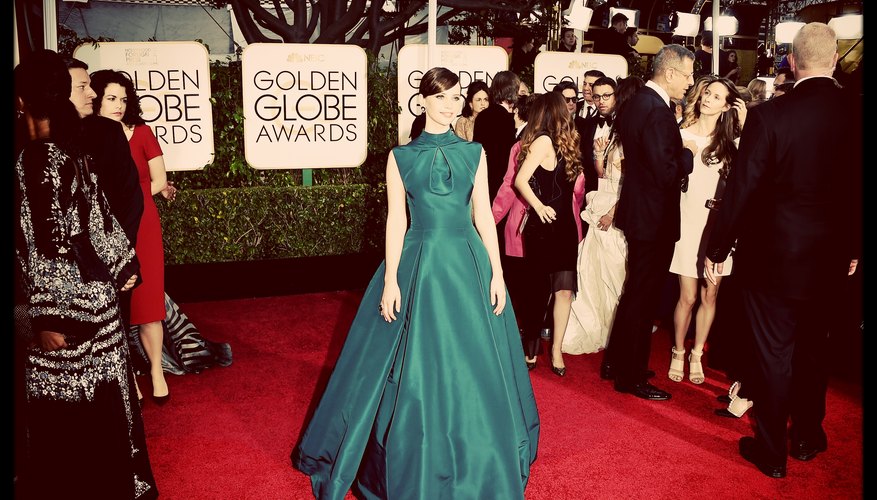 A celebrity walking down the red carpet at the Golden Globe Awards. A celebrity walking down the red carpet at the Golden Globe Awards.